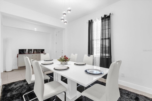 1156 Cavender Creek Rd, Minneola, FL 34715 - tiled dining area featuring baseboards