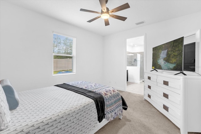 1156 Cavender Creek Rd, Minneola, FL 34715 - bedroom with light colored carpet, ceiling fan, and connected bathroom