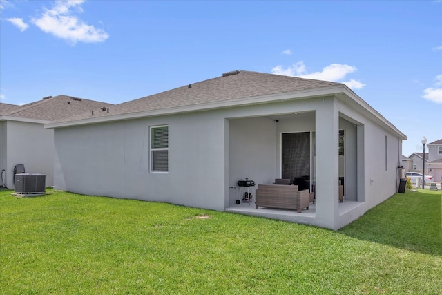 1156 Cavender Creek Rd, Minneola, FL 34715 - back of property with a patio, a yard, roof with shingles, and stucco siding