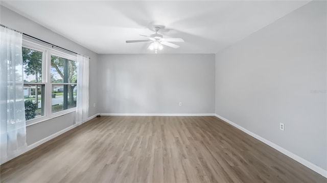 1209 Russell Dr, Ocoee, FL 34761 - empty room featuring light wood finished floors and a ceiling fan
