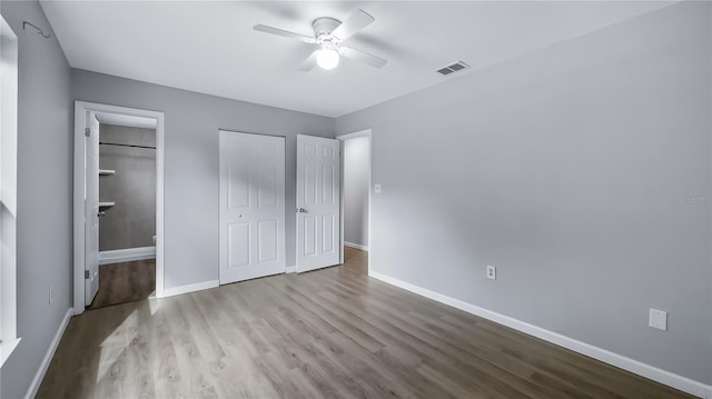 1209 Russell Dr, Ocoee, FL 34761 - unfurnished bedroom with wood finished floors and a ceiling fan