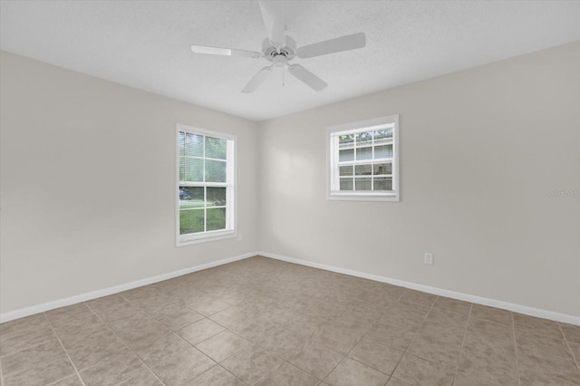 14402 SW 34th Terrace Rd, Ocala, FL 34473 - tiled empty room with a ceiling fan and a textured ceiling