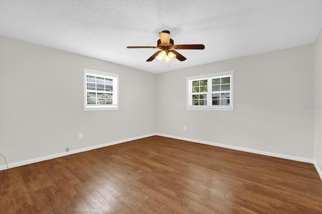 14402 SW 34th Terrace Rd, Ocala, FL 34473 - spare room with healthy amount of natural light, wood finished floors, and a ceiling fan