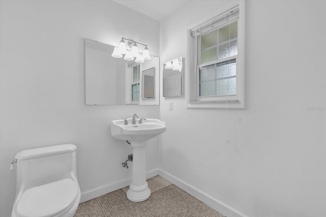 14402 SW 34th Terrace Rd, Ocala, FL 34473 - bathroom with baseboards and toilet