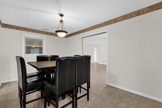 14402 SW 34th Terrace Rd, Ocala, FL 34473 - dining area featuring light tile patterned floors and a textured ceiling