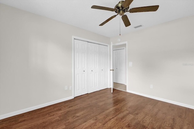 14402 SW 34th Terrace Rd, Ocala, FL 34473 - unfurnished bedroom featuring wood finished floors, a closet, and ceiling fan