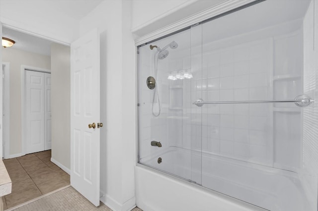 14402 SW 34th Terrace Rd, Ocala, FL 34473 - bathroom featuring bath / shower combo with glass door and tile patterned flooring