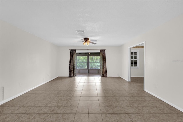 14402 SW 34th Terrace Rd, Ocala, FL 34473 - empty room featuring a ceiling fan and light tile patterned floors
