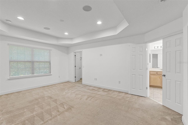 11837 Cave Run Ave, Windermere, FL 34786 - empty room featuring light carpet, recessed lighting, a tray ceiling, and a smoke detector