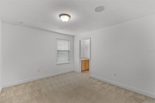 11837 Cave Run Ave, Windermere, FL 34786 - empty room featuring light colored carpet, a textured ceiling, and a smoke detector