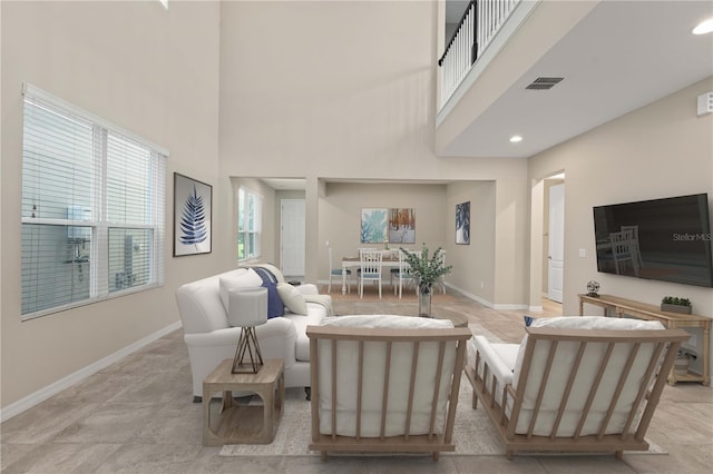 15019 Valverse Aly, Winter Garden, FL 34787 - living area featuring a towering ceiling and recessed lighting