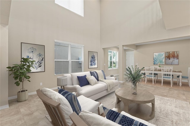 15019 Valverse Aly, Winter Garden, FL 34787 - living room with a towering ceiling and light tile patterned floors