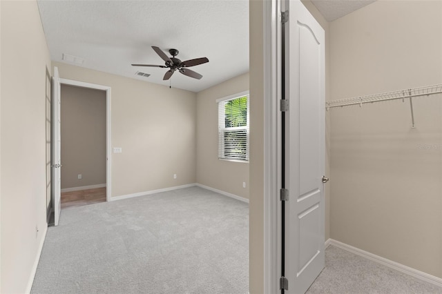 15019 Valverse Aly, Winter Garden, FL 34787 - unfurnished bedroom featuring carpet, a ceiling fan, and a textured ceiling