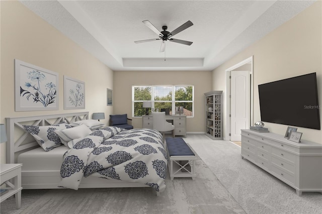 15019 Valverse Aly, Winter Garden, FL 34787 - carpeted bedroom featuring a tray ceiling and ceiling fan