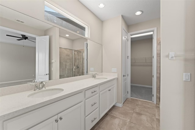 15019 Valverse Aly, Winter Garden, FL 34787 - full bathroom with a stall shower, double vanity, a spacious closet, a ceiling fan, and tile patterned floors