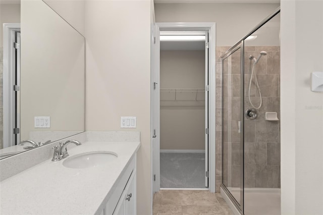 15019 Valverse Aly, Winter Garden, FL 34787 - full bathroom with vanity, a stall shower, and a walk in closet