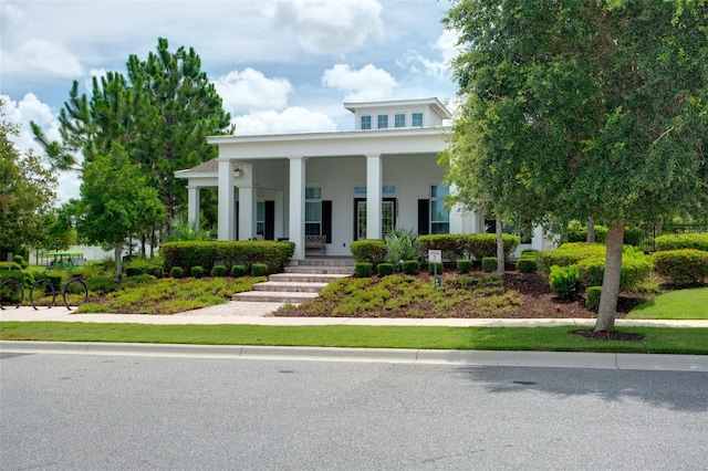 15019 Valverse Aly, Winter Garden, FL 34787 - greek revival house featuring covered porch and stucco siding