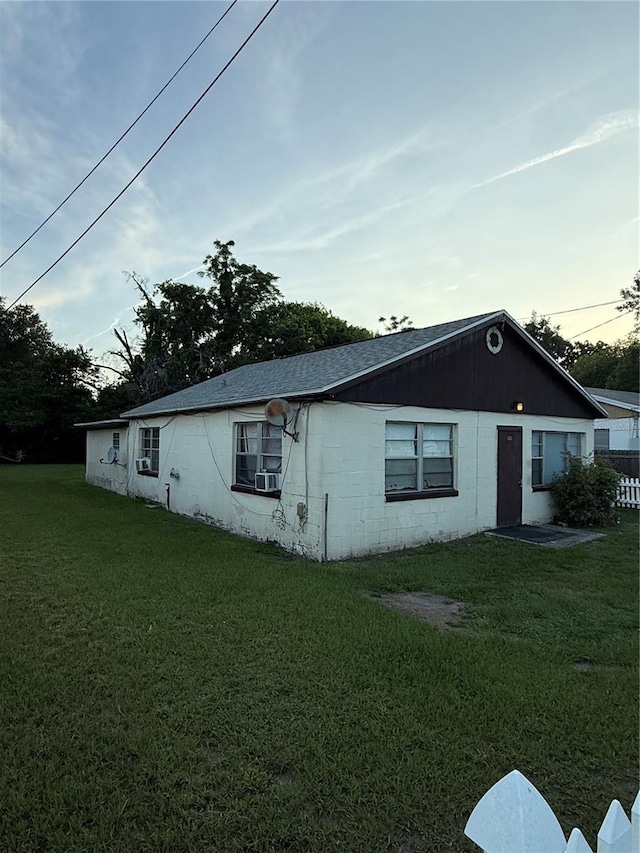 1425 26th St, Orlando, FL 32805 - view of side of home with a lawn and concrete block siding