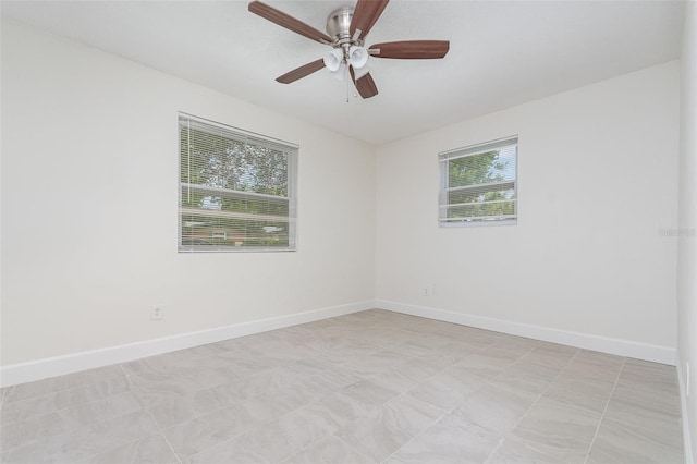 323 Scotland Dr, Daytona Beach, FL 32117 - empty room with baseboards and ceiling fan