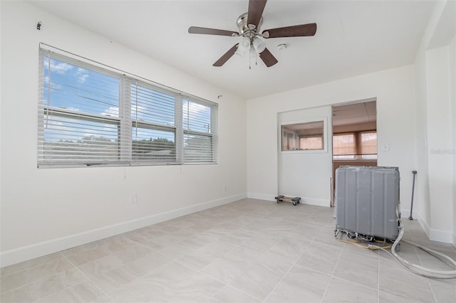 323 Scotland Dr, Daytona Beach, FL 32117 - unfurnished room with plenty of natural light and ceiling fan