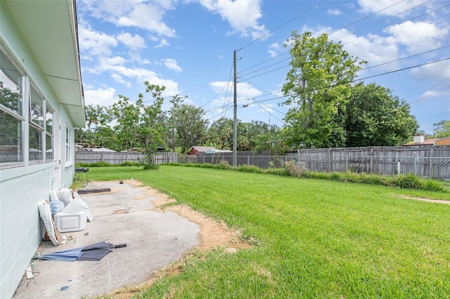 323 Scotland Dr, Daytona Beach, FL 32117 - fenced backyard with a patio area
