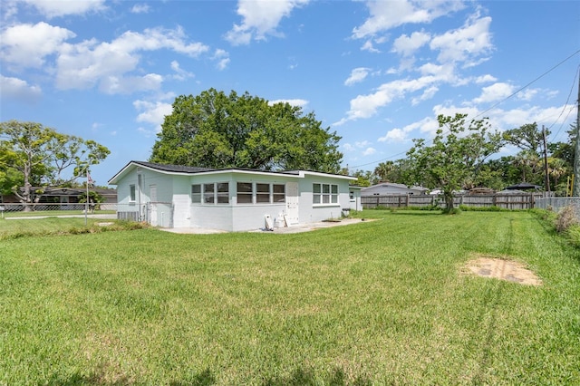 323 Scotland Dr, Daytona Beach, FL 32117 - rear view of house with a fenced backyard
