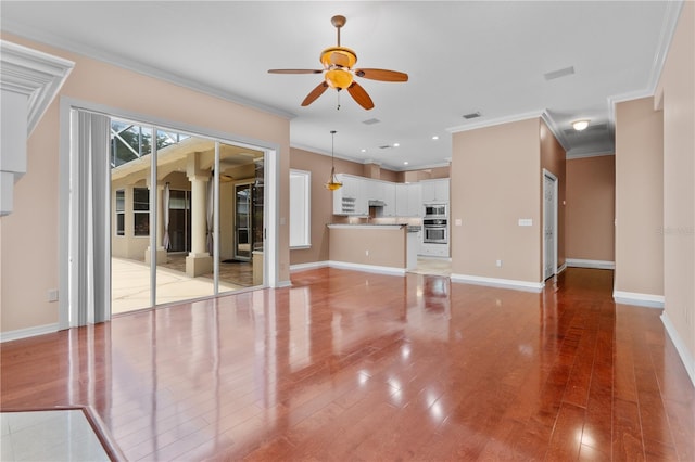 875 Bentley Green Cir, Winter Springs, FL 32708 - unfurnished living room featuring a ceiling fan, ornamental molding, light wood-type flooring, and recessed lighting