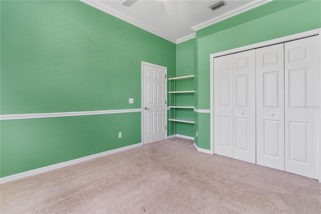 875 Bentley Green Cir, Winter Springs, FL 32708 - unfurnished bedroom featuring carpet flooring, ornamental molding, a closet, and ceiling fan