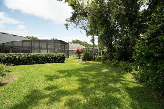 875 Bentley Green Cir, Winter Springs, FL 32708 - view of grassy yard featuring glass enclosure