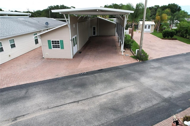 1115 Deer Creek Blvd, Davenport, FL 33837 - view of front facade featuring an attached carport