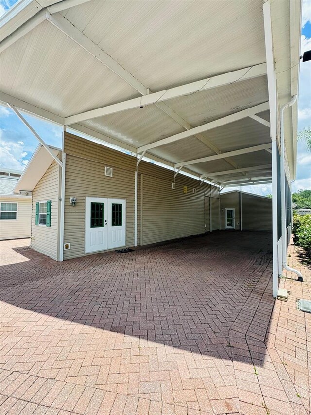 1115 Deer Creek Blvd, Davenport, FL 33837 - garage featuring an attached carport