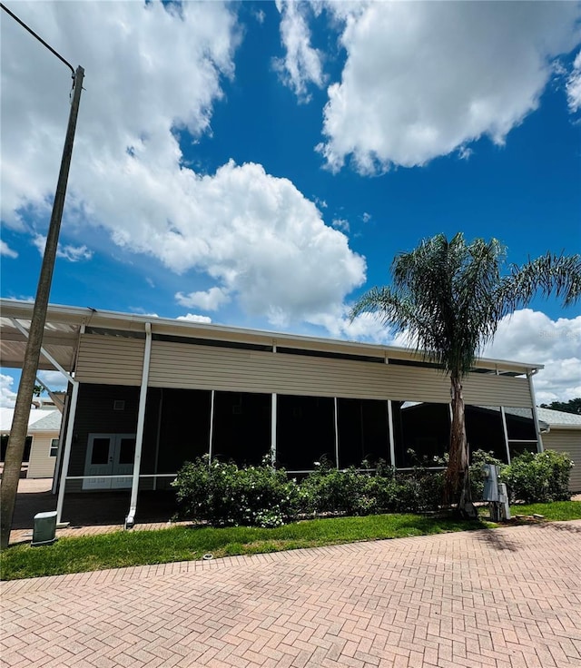1115 Deer Creek Blvd, Davenport, FL 33837 - back of house featuring a sunroom