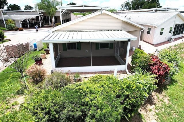 1115 Deer Creek Blvd, Davenport, FL 33837 - back of house with a sunroom