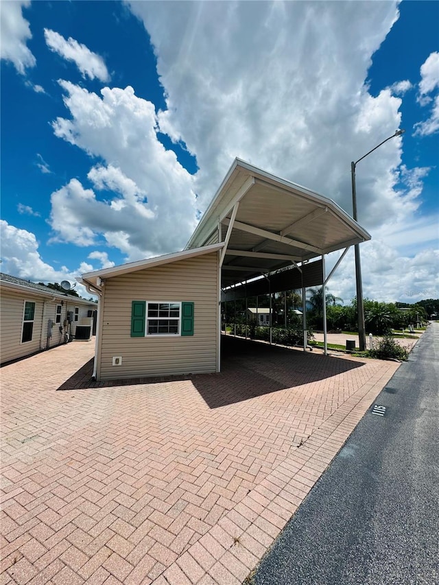 1115 Deer Creek Blvd, Davenport, FL 33837 - view of front facade with an attached carport