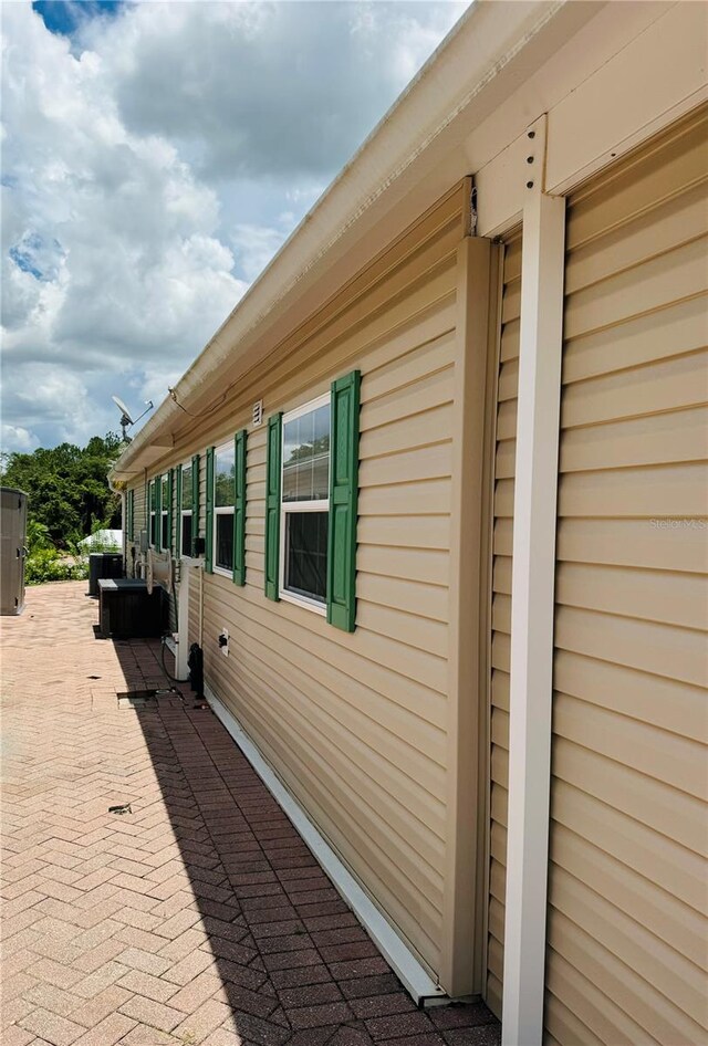 1115 Deer Creek Blvd, Davenport, FL 33837 - view of property exterior with a central AC unit