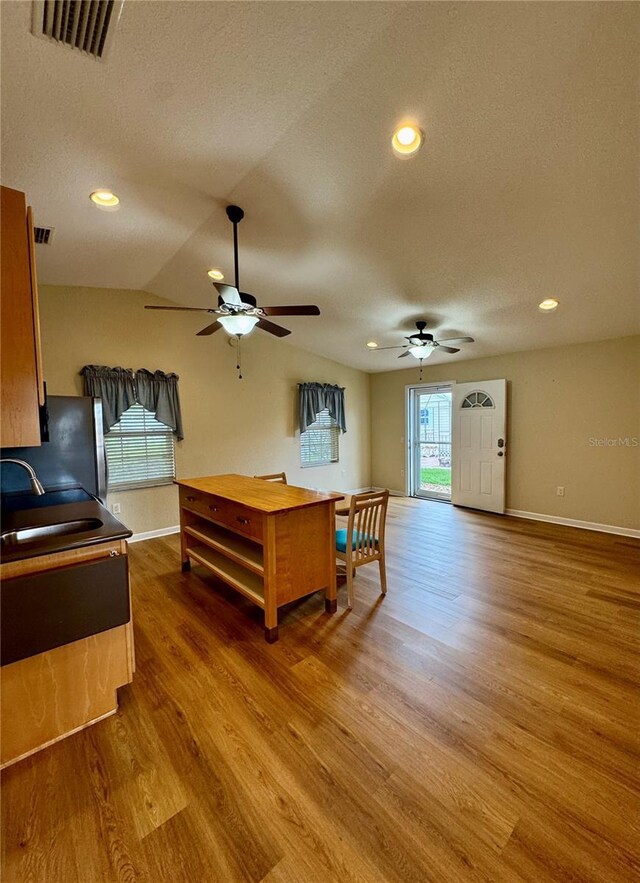 1115 Deer Creek Blvd, Davenport, FL 33837 - living room featuring ceiling fan, wood finished floors, a textured ceiling, and recessed lighting