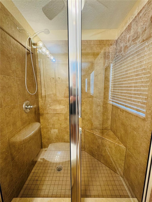 1115 Deer Creek Blvd, Davenport, FL 33837 - full bath with a textured ceiling and a stall shower