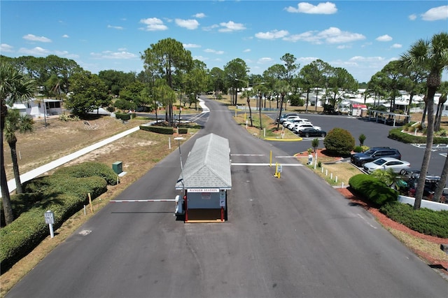 1115 Deer Creek Blvd, Davenport, FL 33837 - view of asphalt street featuring a gated entry