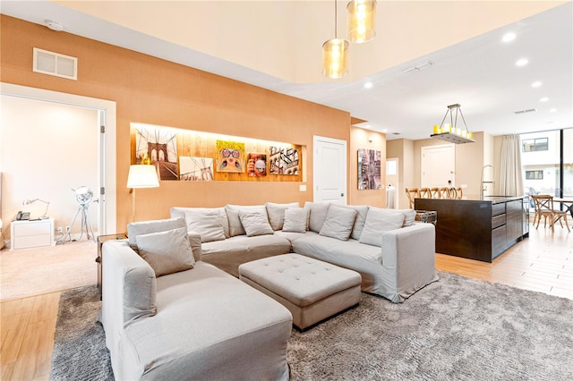 7478 Brooklyn Dr, Kissimmee, FL 34747 - living room with light wood finished floors, recessed lighting, and a high ceiling