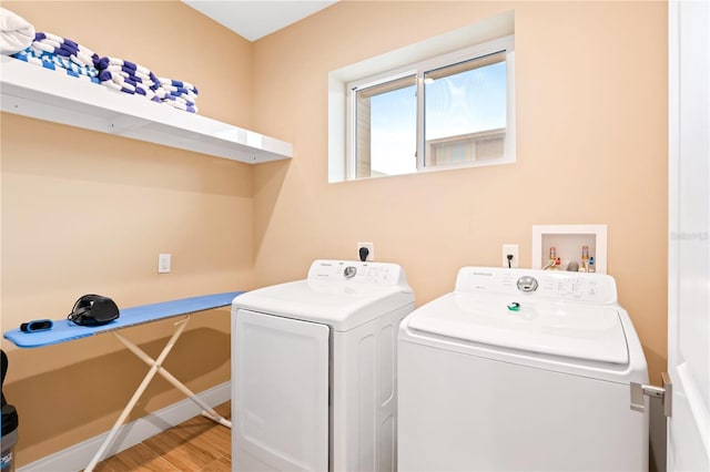 7478 Brooklyn Dr, Kissimmee, FL 34747 - laundry area with washing machine and clothes dryer and light wood-type flooring