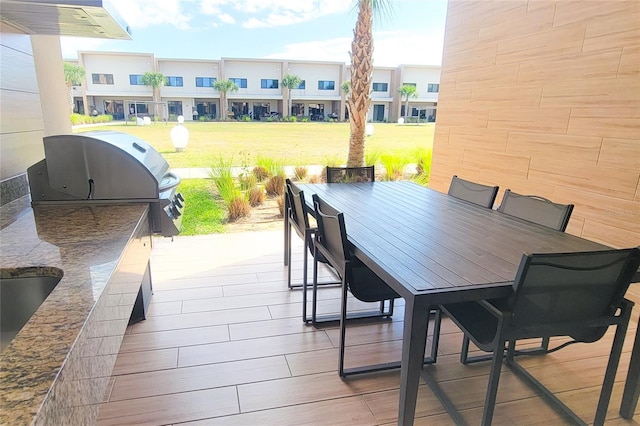 7478 Brooklyn Dr, Kissimmee, FL 34747 - view of patio / terrace featuring outdoor dining area and exterior kitchen