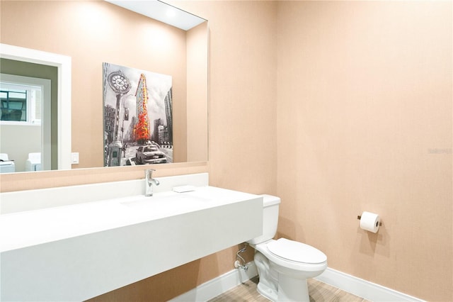 7478 Brooklyn Dr, Kissimmee, FL 34747 - half bathroom with toilet and wood finished floors