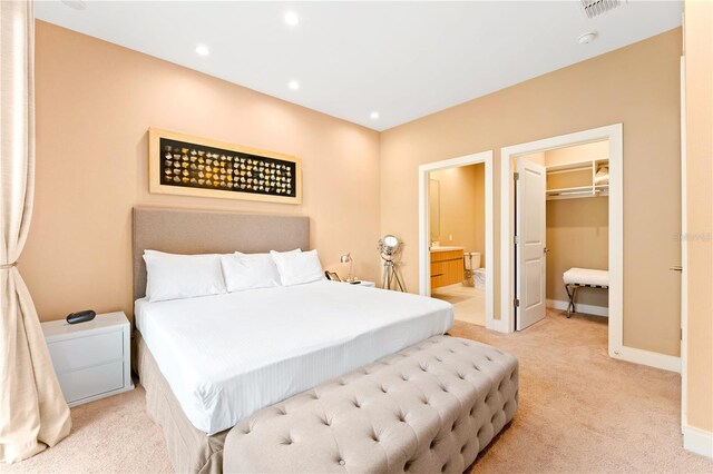 7478 Brooklyn Dr, Kissimmee, FL 34747 - bedroom with light carpet, recessed lighting, ensuite bath, and a walk in closet