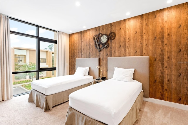7478 Brooklyn Dr, Kissimmee, FL 34747 - bedroom featuring wooden walls, expansive windows, light colored carpet, recessed lighting, and access to outside