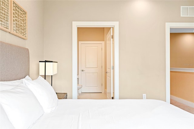 7478 Brooklyn Dr, Kissimmee, FL 34747 - bedroom featuring baseboards and ensuite bath