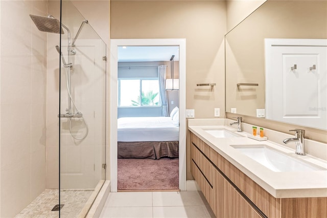 7478 Brooklyn Dr, Kissimmee, FL 34747 - ensuite bathroom featuring a tile shower, double vanity, and tile patterned floors