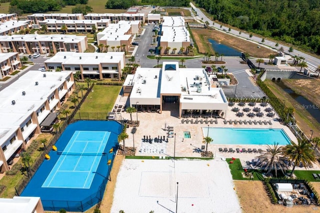 7478 Brooklyn Dr, Kissimmee, FL 34747 - drone / aerial view of a pool area and a nearby body of water