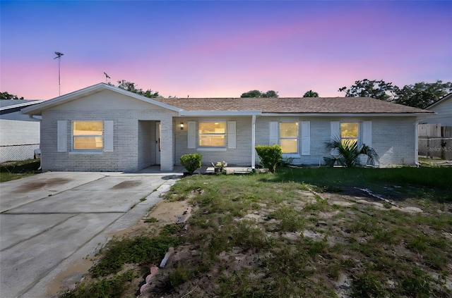 105 E Magnolia St, Davenport, FL 33837 - ranch-style house with brick siding and driveway