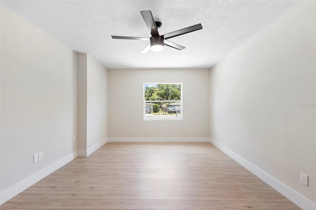 105 E Magnolia St, Davenport, FL 33837 - empty room featuring a ceiling fan, light wood-style flooring, and a textured ceiling
