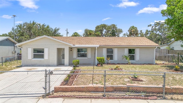 105 E Magnolia St, Davenport, FL 33837 - single story home with brick siding, a porch, and a fenced front yard